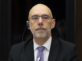 Parliamentary Budget Officer Yves Giroux waits to appear before appearing at the Senate Committee on National Finance on October 25, 2022 in Ottawa.