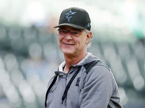 Miami Marlins manager Don Mattingly smiles after throwing a ball to fans before a baseball game against the Milwaukee Brewers, Saturday, Oct. 1, 2022, in Milwaukee. The Toronto Blue Jays have hired Mattingly to serve as bench coach under manager John Schneider.
