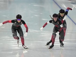 Team Canada, with Valerie Maltais, left, Ivanie Blondin and Isabelle Weidemann, right, compete during the speedskating women's team pursuit finals at the 2022 Winter Olympics, Tuesday, Feb. 15, 2022, in Beijing. Canada won gold in the women's team pursuit and silver in the men's 500 metres Saturday on the second day of the season-opening World Cup stop.THE CANADIAN PRESS/AP, Ashley Landis