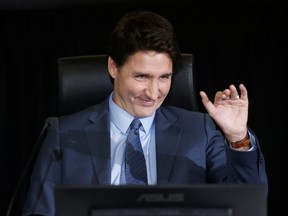 Canada's Prime Minister Justin Trudeau reacts as he prepares to testify after a break at the Public Order Emergency Commission in Ottawa, Ontario, Canada November 25, 2022. REUTERS/Blair Gable