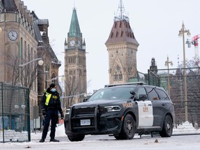 A police officer mans a checkpoint near Parliament Hill in Ottawa on Feb. 23.