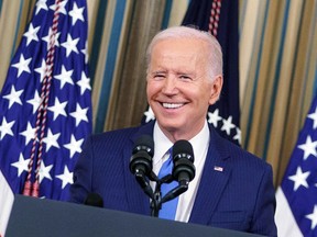 U.S. President Joe Biden smiles during a post-midterm election press conference in the White House on November 9, 2022. Democrats did better than history suggested they would.