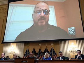 Oath Keepers founder Stewart Rhodes is seen on a screen during a House Select Committee hearing to Investigate the January 6th Attack on the U.S. Capitol, June 9, 2022.