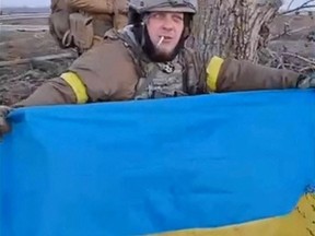 Ukrainian soldiers advance towards Kherson in South-east of Posad-Pokrovske, Kherson Oblast, Ukraine November 10, 2022 in this screen grab obtained from a video.  (REUTERS)
