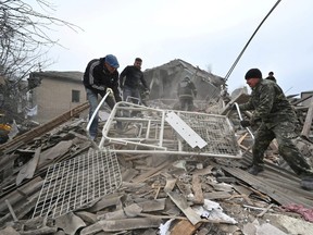 Rescuers search destroyed maternity hospital in southern Ukraine
