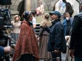 Florence Pugh and director Sebastián Lelio on the set of The Wonder.