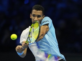 Canada's Felix Auger-Aliassime returns the ball to United States' Taylor Fritz during their singles tennis match of the ATP World Tour Finals, at the Pala Alpitour in Turin, Italy, Thursday, Nov. 17, 2022.&ampnbsp;Auger-Aliassime dropped a 7-6 (4), 6-7 (5), 6-2 decision to Fritz on Thursday at the ATP Finals.