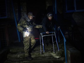 Elderly residents are evacuated from the southern city of Kherson, Ukraine, Sunday, Nov. 27, 2022.&ampnbsp;Prime Minister Justin Trudeau says $500 million in five-year bonds issued by Canada to support the Ukrainian government have been fully subscribed.