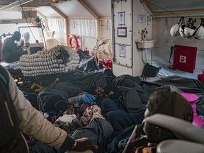 Migrants on the deck of the Rise Above rescue ship run by the German organization Mission Lifeline, in the Mediterranean Sea off the coasts of Sicily, southern Italy, Saturday, Nov. 5, 2022. Italy allowed one rescue ship, the German run Humanity 1, to enter the Sicilian port and begin disembarking minors, but refused to respond to requests for safe harbor from three other ships carrying 900 more people in nearby waters.