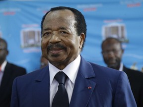 FILE - In this Oct. 7, 2018 file photo, Cameroon's President Paul Biya, of the Cameroon People's Democratic Movement party, during the Presidential elections in Yaounde, Cameroon. President Paul Biya is marking 40 years in power but staying out of the spotlight as questions swirl around the 89-year-old leader. Biya has not appeared in public since French President Emmanuel Macron visited the Central African nation in July,