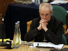 FILE - The Archbishop of Canterbury Justin Welby listens to debate at the General Synod in London, on Feb. 13, 2017. Less than half of people in England and Wales consider themselves Christian, according to the most recent census – the first time the country's official religion has been followed by a minority of the population. Figures from the 2021 census released Tuesday, Nov. 29, 2022, by the Office for National Statistics reveal that Britain has become less religious, and less white, in the decade since the last census in 2011.