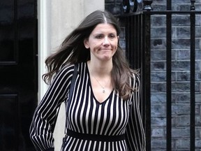 FILE - Britain's Secretary of State for Digital, Culture, Media and Sport Michelle Donelan leaves after a cabinet meeting at 10 Downing Street in London, Tuesday, Oct. 18, 2022. The British government has abandoned a plan to force tech firms to remove internet content that is harmful but legal, a proposal that drew strong criticism from lawmakers and civil liberties groups. Digital Secretary Michelle Donelan said the plan has been dropped because it would have created "a quasi-legal category between illegal and legal."