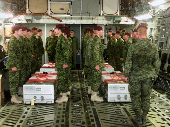 Members of the Princess Patricia’s Canadian Light Infantry pay their last respects aboard a United States Air Force C 17 aircraft to four of their fallen comrades who were killed in a training accident near Kandahar, Afghanistan in April 2002. - DND