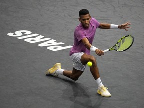 Felix Auger-Aliassime of Canada returns the ball to Holger Rune from Denmark during their semi final match of the Paris Masters tennis tournament at the Accor Arena in Paris, Saturday, Nov. 5, 2022.&ampnbsp;The Montreal native fell to Denmark's Holger Rune 6-4, 6-2 on Saturday in the semifinals of the Paris Masters.