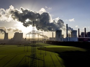 FILE - Steam rises from the coal-fired power plant Neurath near Grevenbroich, Germany, Nov. 2, 2022. Nearly 50 heads of states or governments on Monday will take the stage in the first day of "high-level" international climate talks in Egypt with more to come in following days.