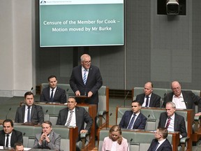 Former Australian Prime Minister Scott Morrison, standing at rear, speaks during a censure motion against him in the House of Representatives at Parliament House in Canberra, Australia, Wednesday, Nov. 30, 2022. Morrison has listed his achievements in government including standing up to a "bullying" China as he unsuccessfully argued against being censured by the Parliament for secretly amassing multiple ministerial powers.