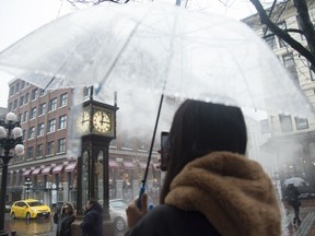 People walk by the steam clock in Gas Town in downtown Vancouver, B.C., Tuesday, Dec. 31, 2019. Most Canadians will be turning the clocks back by an hour this weekend as various political moves to end seasonal time changes have yet to take broad effect – but experts say we'd be better off without the bi-annual shift.&ampnbsp;THE CANADIAN PRESS/Jonathan Hayward