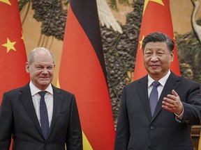 German Chancellor Olaf Scholz, left, meets Chinese President Xi Jinping at the Great Hall of People in Beijing, China, Friday, Nov. 4, 2022.