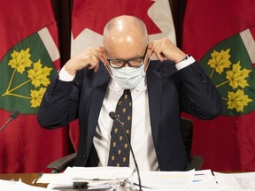 Ontario Chief Medical Officer Dr. Kieran Moore attends a press briefing at the Queens Park Legislature, in Toronto, on Monday, November 14, 2022. Ontario Premier Doug Ford is downplaying the significance of footage posted online that appears to show the province's top doctor attending an indoor party maskless, days after he recommended masking in all indoor spaces.