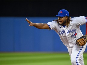 Toronto Blue Jays first baseman Vladimir Guerrero Jr. (27) forces out Philadelphia Phillies shortstop Didi Gregorius (18) at first base during sixth inning interleague MLB action in Toronto on Tuesday, July 12, 2022. Guerrero has won his first career American League Gold Glove Award.