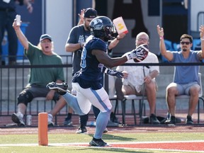 Toronto Argonauts' Wynton McManis scores a touchdown after making an interception during the second half of CFL action against the Saskatchewan Roughriders at Acadia University in Wolfville, N.S., Saturday, July 16, 2022.