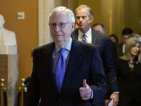 Senate Minority Leader Mitch McConnell of Ky., gestures after being reelected as Republican leader, quashing a challenge from Sen. Rick Scott, R-Fla., in the Senate Republican leadership elections on Capitol Hill in Washington, Wednesday, Nov. 16, 2022.
