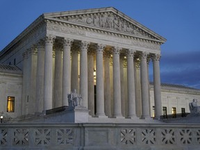 Light illuminates part of the Supreme Court building at dusk on Capitol Hill in Washington, Wednesday, Nov. 16, 2022.