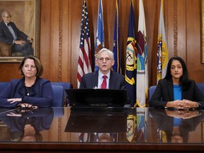 Attorney General Merrick Garland speaks at a news conference about the Justice Department's intervention to try to bring improvements to the beleaguered water system in Jackson, Miss., at the Justice Department in Washington, Wednesday, Nov. 30, 2022. At left is Deputy Attorney General Lisa Monaco and Associate Attorney General Vanita Gupta, right.