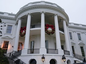 Wreaths hang on the Truman Balcony of the White House in Washington, Sunday, Nov. 27, 2022.