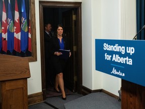 Alberta Premier Danielle Smith makes her way to a press conference after the speech from the throne in Edmonton, Tuesday, Nov. 29, 2022. When the Alberta legislature resumed sitting Tuesday, the first bill introduced by the United Conservative Party government aims to shield the province from federal laws it deems harmful to its interests.