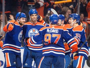 Edmonton Oilers' Leon Draisaitl (29), Darnell Nurse (25), Connor McDavid (97), Devin Shore (14) and Dylan Holloway (55) celebrate a goal against the Florida Panthers during overtime NHL action in Edmonton, Monday, Nov. 28, 2022.