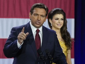 Incumbent Florida Republican Gov. Ron DeSantis speaks to supporters at an election night party after winning his race for reelection in Tampa, Fla., Tuesday, Nov. 8, 2022, as his wife Casey listens.