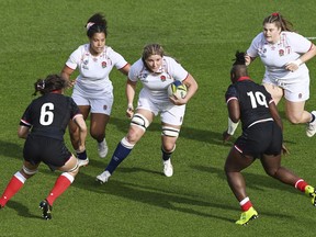 Sarah Bern of England runs at the defense during the women's rugby World Cup semifinal between Canada and England at Eden Park in Auckland, New Zealand, Saturday, Nov.5, 2022.