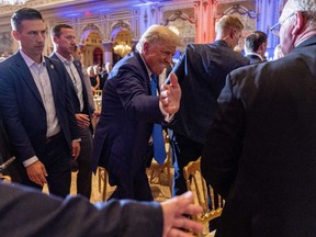 Former President Donald Trump greats guests at Mar-a-lago on Election Day, Tuesday, Nov. 8, 2022, in Palm Beach, Fla.