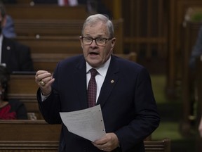 Veterans Affairs Minister Lawrence MacAulay rises during Question Period, Tuesday, December 14, 2021 in Ottawa.