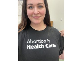 Megan Johnston, seen in a handout photo, says Saskatchewan legislature security had asked to her remove her T-shirt that says "abortion is health care." She says security followed her to the washroom after they instructed her to turn her shirt inside out.THE CANADIAN PRESS/HO-Megan Johnston, *MANDATORY CREDIT*