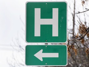 A sign for a hospital in Montreal, Sunday, Feb. 6, 2022. The Quebec coroner's office has rejected a request by a Montreal family to launch a new investigation into the death of an 86-year-old Filipino woman found lifeless on the floor of a Montreal-area emergency room last year.