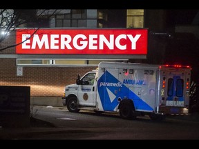 An ambulance arrives at the emergency entrance of Toronto Western Hospital.
