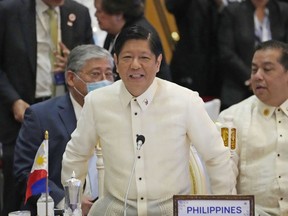 Philippine President Ferdinand Marcos Jr. stands during the ASEAN Australia-New Zealand Trade Area (AANZTA) in Phnom Penh, Cambodia, Sunday, Nov. 13, 2022.
