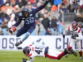Toronto Argonauts running back Javon Leake (32) evades a tackle from Montreal Alouettes defensive back Kenneth Durden (45) on a kick return during first half CFL Eastern Final football action in Toronto on Sunday, November 13, 2022.