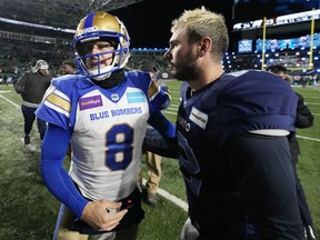 Toronto Argonauts quarterback Chad Kelly (12) and Winnipeg Blue Bombers quarterback Zach Collaros (8) shake hands after the Argonauts defeated the Blue Bombers in the 109th Grey Cup at Mosaic Stadium in Regina, Sunday, Nov. 20, 2022.&ampnbsp;Collaros made no excuses after the Toronto Argonauts upset the two-time defending Grey Cup champion Winnipeg Blue Bombers 24-23 Sunday in the CFL title game.