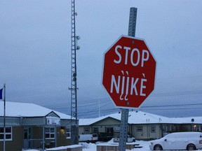 A stop sign is shown in English and in Wiillideh in Dettah, Northwest Territories on Friday, Nov. 25, 2022. The federal government says it's investing $39.4 million to support Indigenous languages in the territories.