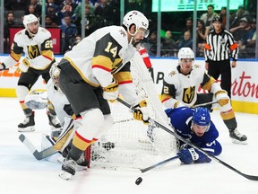 Toronto Maple Leafs forward Auston Matthews (34) tries a wraparound as Vegas Golden Knights defenceman Nicolas Hague (14) and defenceman Zach Whitecloud (2) defend during second period NHL hockey action in Toronto on Tuesday, November 8, 2022.