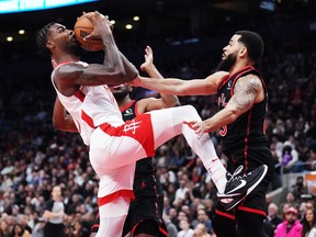 Houston Rockets forward Tari Eason (17) is stopped by Toronto Raptors guard Fred VanVleet (23) during second half NBA basketball action in Toronto on Wednesday, November 9, 2022.
