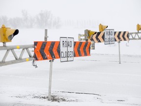 A sign shows that the Trans Canada highway is closed in Winnipeg, Wednesday, April 13, 2022. The province says the Trans-Canada Highway from Falcon Lake to the Ontario boundary is closed along with Highway 12 from Steinbach to the U.S. border.THE CANADIAN PRESS/John Woods