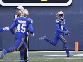 Winnipeg Blue Bombers' Winston Rose (30) celebrates his interception against the Saskatchewan Roughriders during the second half of CFL football action in Winnipeg, Saturday, Sept. 10, 2022. Rose, a native Californian, has warmed up to the idea of playing football in Canada in November.&ampnbsp;THE CANADIAN PRESS/John Woods