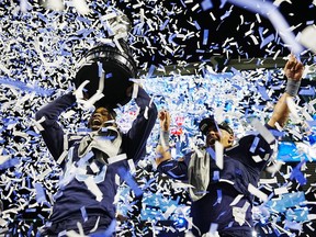 Toronto Argonauts wide receiver Brandon Banks (left) and running back Andrew Harris celebrate after beating the Winnipeg Blue Bombers in the 109th Grey Cup at Mosaic Stadium in Regina, Sunday, Nov. 20, 2022.