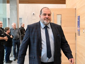 Former Parti Québécois legislator Harold LeBel walks out of the courtroom during a break at the courthouse, in Rimouski, Que., Monday, Nov. 14, 2022.