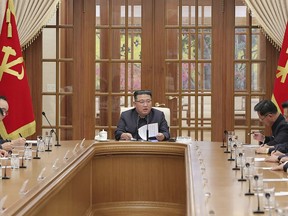 This photo provided on Dec. 1, 2022, by the North Korean government shows North Korean leader Kim Jong Un, center, attends a meeting of the Central Committee of the ruling Workers' Party in Pyongyang, on Nov. 30, 2022. Independent journalists were not given access to cover the event depicted in this image distributed by the North Korean government. The content of this image is as provided and cannot be independently verified. (Korean Central News Agency/Korea News Service via AP)