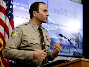 FILE - Maricopa County Sheriff Paul Penzone speaks at a news conference in Phoenix on Feb. 14, 2019. On Tuesday, Nov. 8, 2022, a federal judge held Penzone in civil contempt of court in the same racial profiling case that his predecessor, Joe Arpaio, was held in contempt of six years earlier. Penzone's contempt ruling stemmed from his failure to complete internal affairs investigations in a timely manner, leading to a huge backlog of cases. Arpaio was found in contempt for disobeying a 2011 court order to stop his traffic patrols that targeted immigrants.